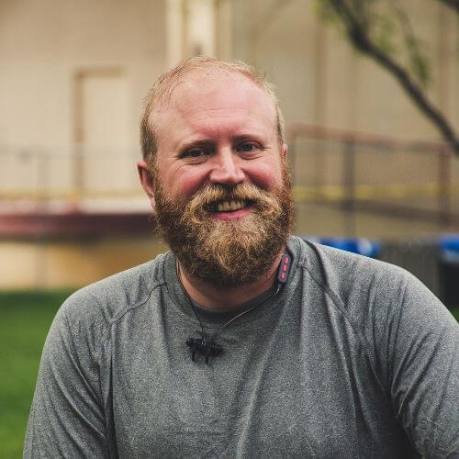 Man holding Prosta Defend bottle with 5-star review